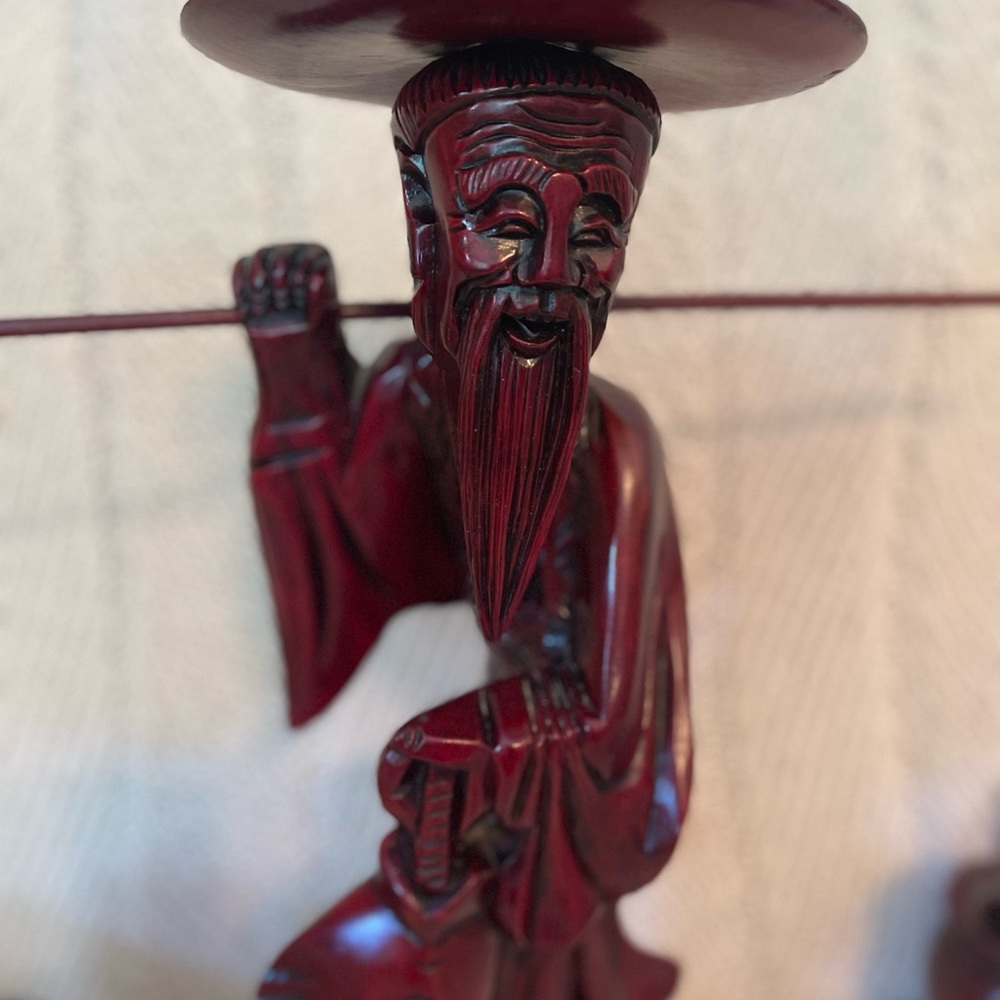 Antique hand-carved Oriental man with buckets